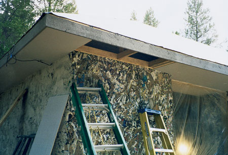 
The house has a 1,500-square-foot footprint, but because of the thickness of the walls, only 1,200 square feet of living space. The bales were tested in a laboratory for fire resistance, compression, and insulation. Building with paper bales is similar to building with straw bales, although the paper is structural whereas straw is generally not. Wire netting was stapled directly onto the bales before the stucco was applied.
